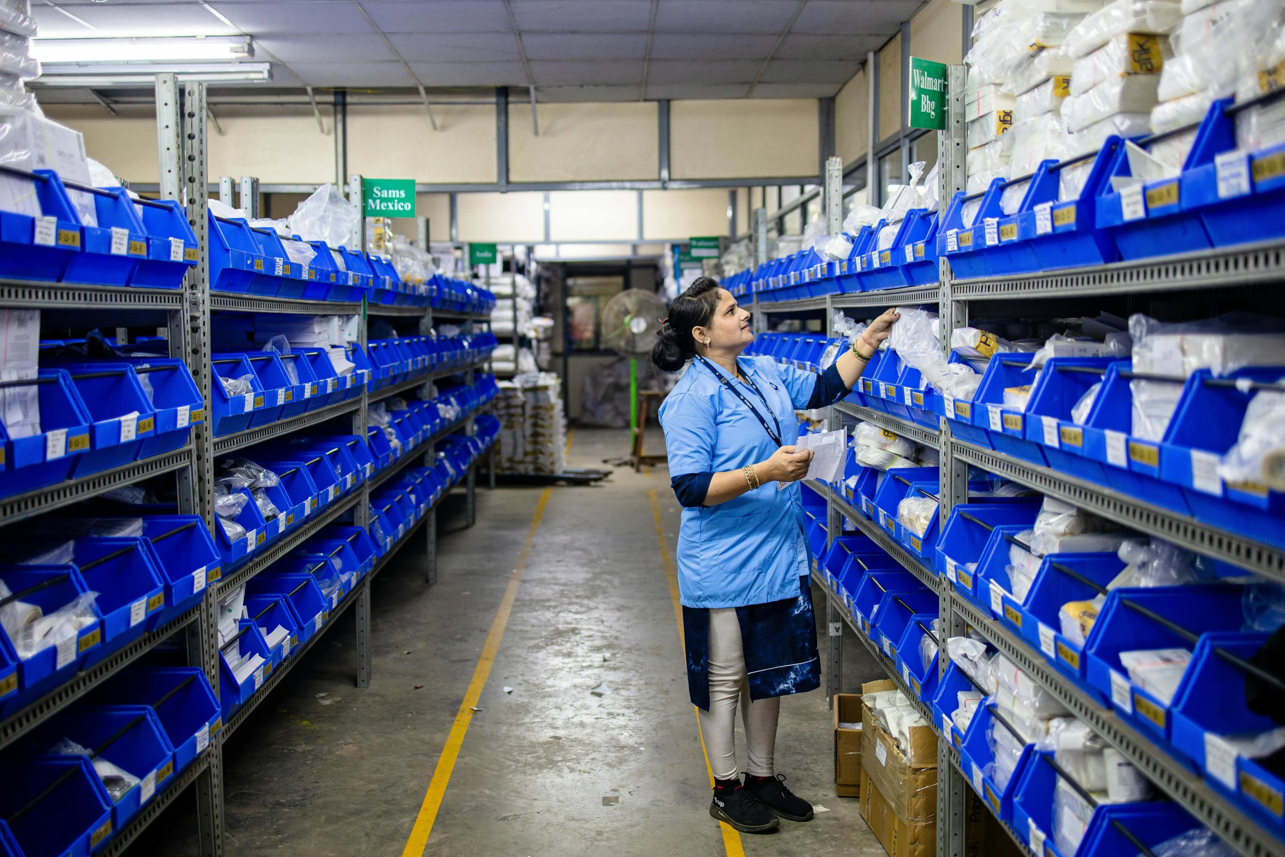 WinsBS apparel fulfillment warehouse staff packing clothing orders for U.S. ecommerce brands